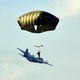 Illustration for article titled Cool photo of a paratrooper makes it look like he's surfing an airplane